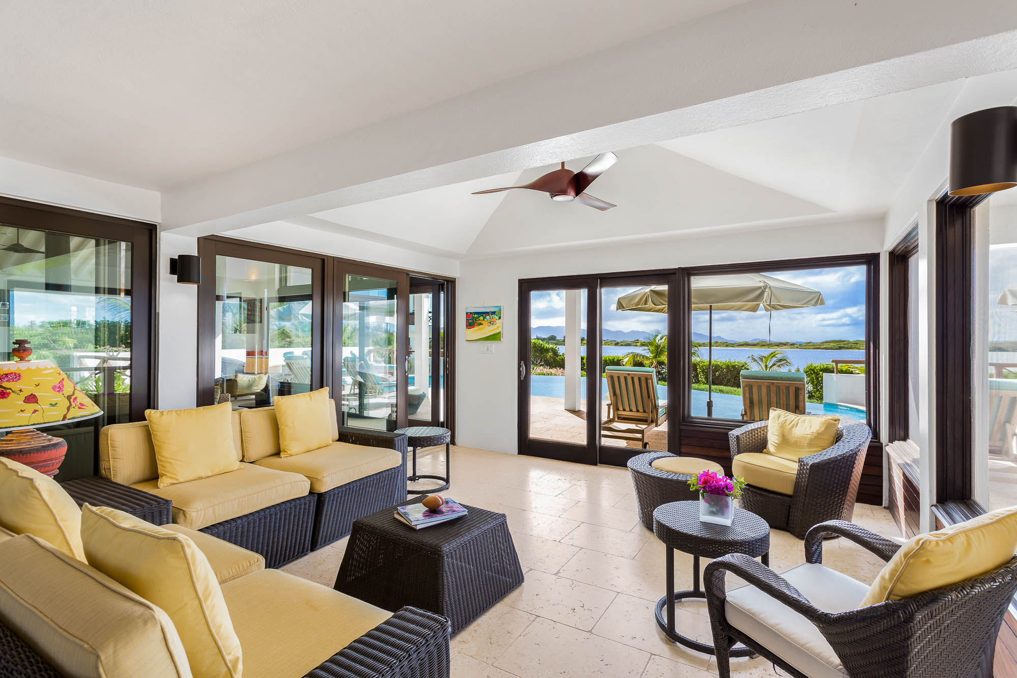 Living area with sliding doors opening to the pool